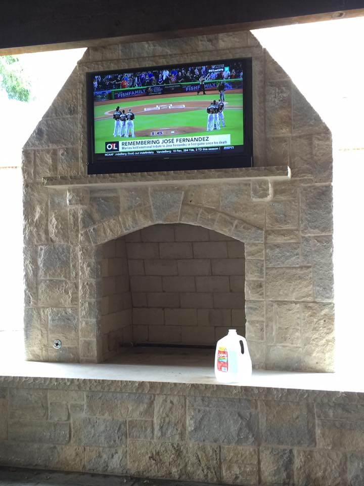 outdoor fireplace with TV